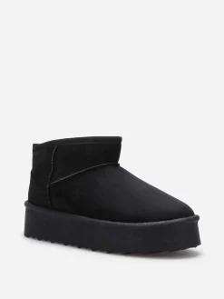 Online La Modeuse Boots fourrées à plateforme Noir