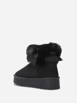 Outlet La Modeuse Boots fourrées à plateforme et n艙ud Noir