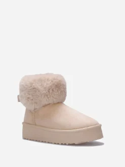 New La Modeuse Boots fourrées à plateforme et n艙ud Beige