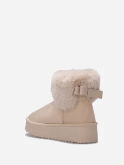 New La Modeuse Boots fourrées à plateforme et n艙ud Beige
