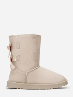 New La Modeuse Boots fourrées à rubans noués Beige