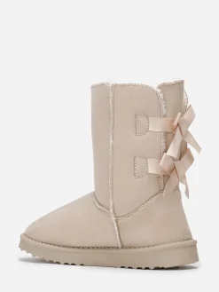 New La Modeuse Boots fourrées à rubans noués Beige