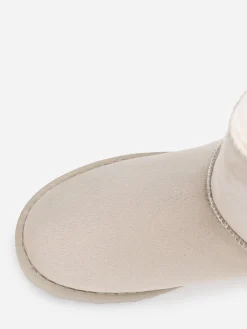 New La Modeuse Boots fourrées à rubans noués Beige