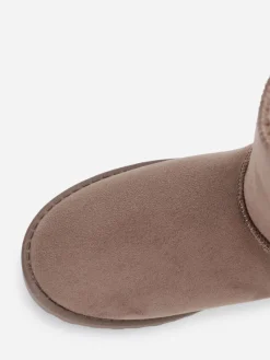 La Modeuse Boots fourrées à rubans noués Taupe
