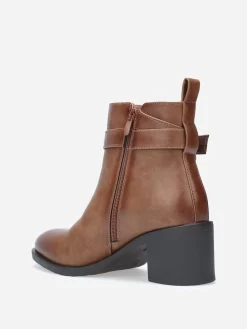 New La Modeuse Bottines à bride et boucle métallique Marron