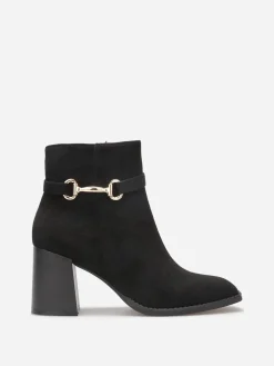 New La Modeuse Bottines à talon en suédine avec mors doré Noir