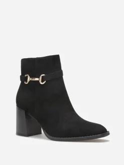 New La Modeuse Bottines à talon en suédine avec mors doré Noir