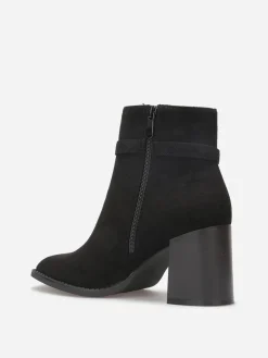 New La Modeuse Bottines à talon en suédine avec mors doré Noir