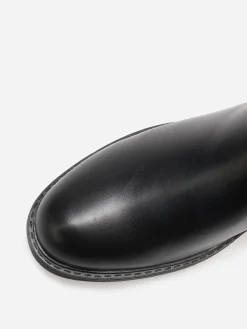 Discount La Modeuse Bottines bi-matières à boucle métallique Noir