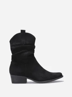 Outlet La Modeuse Bottines santiags froncées en suédine Noir