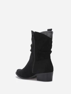 Outlet La Modeuse Bottines santiags froncées en suédine Noir