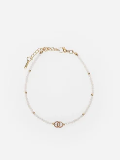 New La Modeuse Chaîne de cheville en perles émaillées Beige