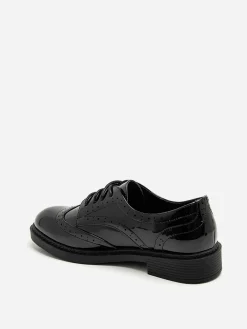 New La Modeuse Derbies vernies à détails ajourés Noir
