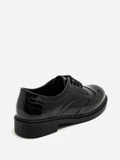New La Modeuse Derbies vernies à détails ajourés Noir