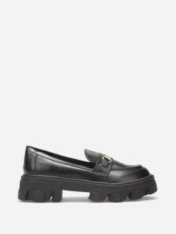New La Modeuse Mocassins crantés à détail métallique Noir