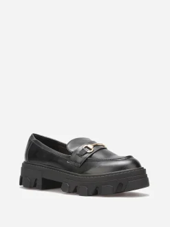New La Modeuse Mocassins crantés à détail métallique Noir