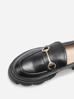 New La Modeuse Mocassins crantés à détail métallique Noir