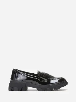 La Modeuse mocassins crantés en simili verni Noir
