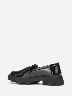 La Modeuse mocassins crantés en simili verni Noir