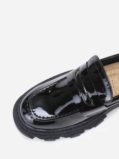 La Modeuse mocassins crantés en simili verni Noir