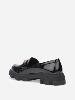 La Modeuse Mocassins vernis crantés à mors doré Noir