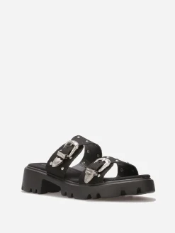 Sale La Modeuse Mules à boucles et clous argentés Noir