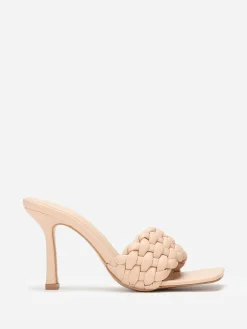 La Modeuse Mules à bride matelassée et tressée Beige