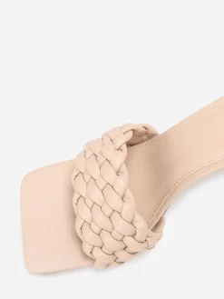 La Modeuse Mules à bride matelassée et tressée Beige