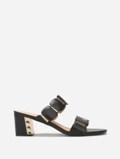 Online La Modeuse Mules à double brides et détails dorés Noir