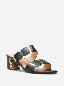 Online La Modeuse Mules à double brides et détails dorés Noir