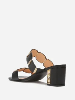 Online La Modeuse Mules à double brides et détails dorés Noir