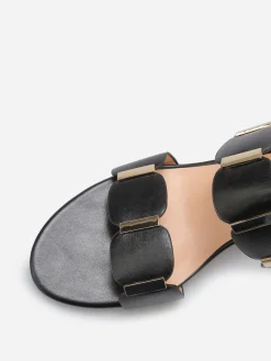 Online La Modeuse Mules à double brides et détails dorés Noir
