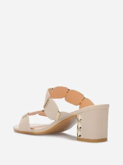 Sale La Modeuse Mules à double brides et détails dorés Beige