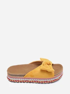 New La Modeuse Mules à noeud et semelle à motifs Jaune