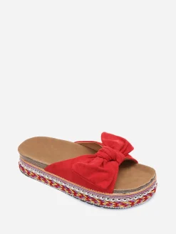 Discount La Modeuse Mules  à noeud et semelle à motifs Rouge