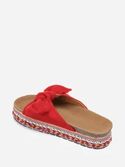 Discount La Modeuse Mules  à noeud et semelle à motifs Rouge