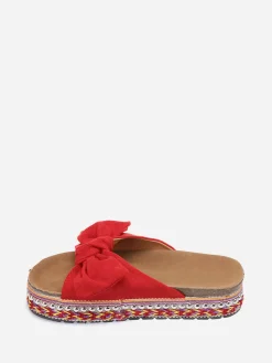 Discount La Modeuse Mules  à noeud et semelle à motifs Rouge