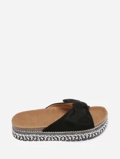New La Modeuse Mules à noeud et semelle à motifs Noir