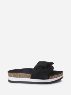 Hot La Modeuse Mules à semelle creuse et noeud Noir