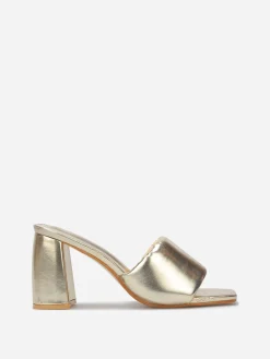 Outlet La Modeuse Mules à talon et bride rembourrée Doré
