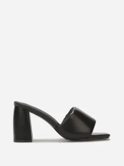 La Modeuse Mules à talon et bride rembourrée Noir