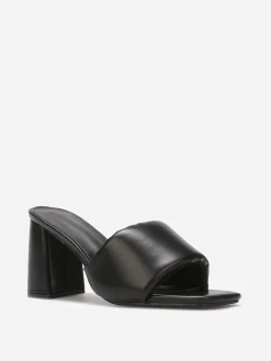 La Modeuse Mules à talon et bride rembourrée Noir