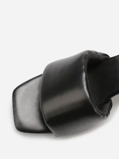 La Modeuse Mules à talon et bride rembourrée Noir