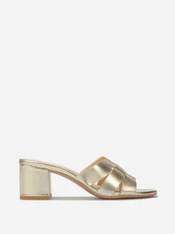La Modeuse Mules à talon et brides entrecroisées Doré