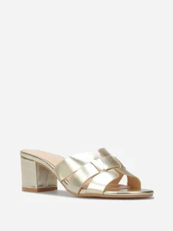 La Modeuse Mules à talon et brides entrecroisées Doré
