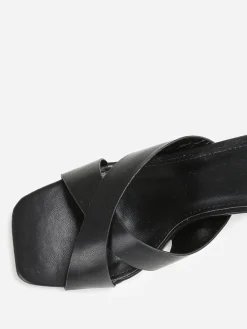 Discount La Modeuse Mules à talon trapèze et brides croisées Noir