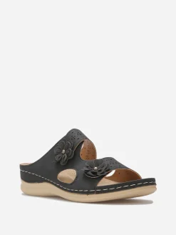 New La Modeuse Mules ajourées à détails fleurs Noir