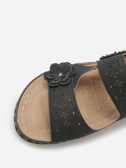 New La Modeuse Mules ajourées à détails fleurs Noir