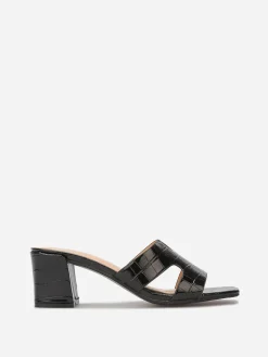 Discount La Modeuse Mules ajourées à talon carré Noir