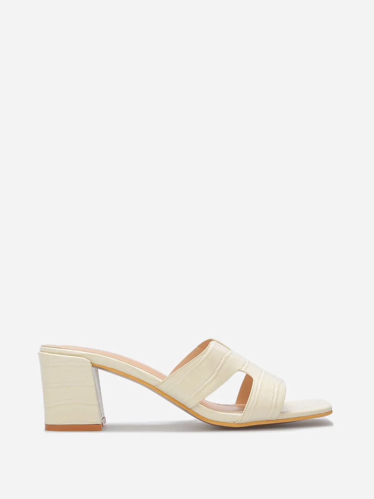 La Modeuse Mules ajourées à talon carré Beige